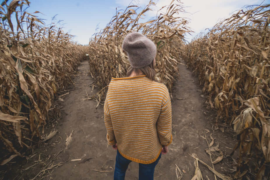 woman chosing path in a maze